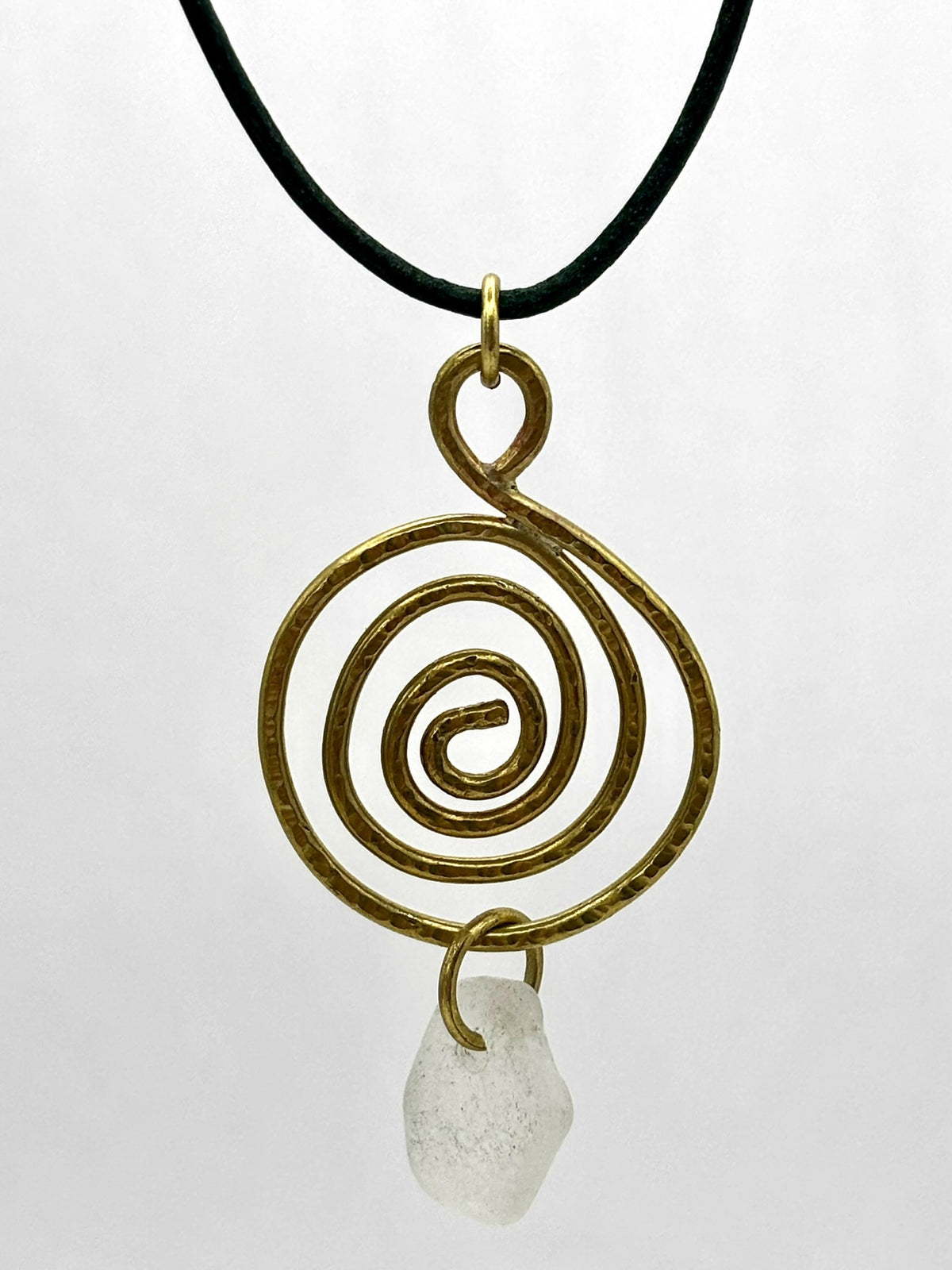 Brass whirlpool and sea glass pendant
